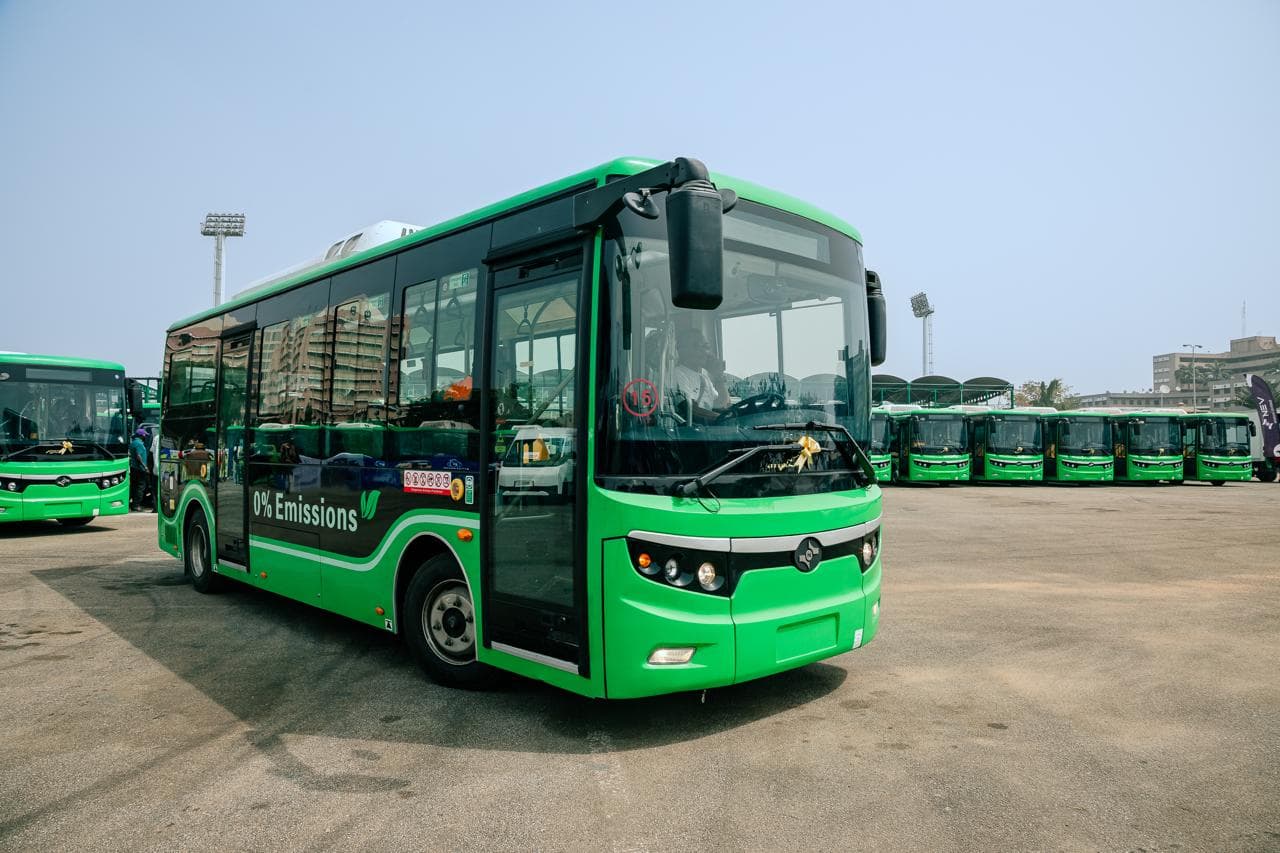 Possible EVS team outdoors in front of an electric bus